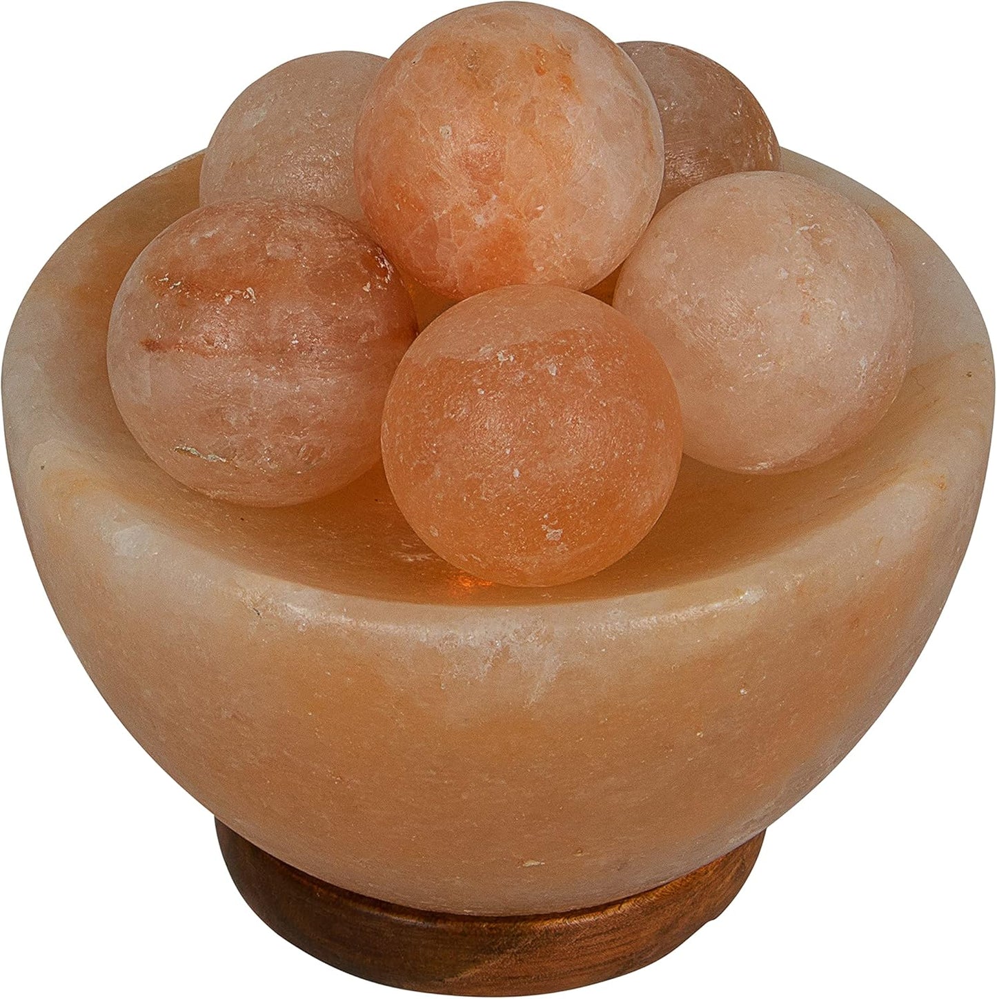 Himalayan salt lamp with spherical salt crystals on a white background