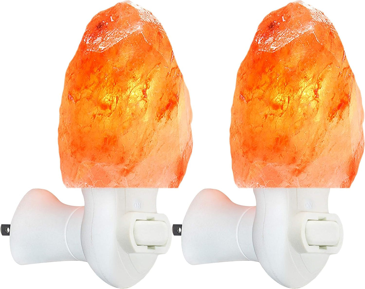 Two Himalayan salt lamps on white background