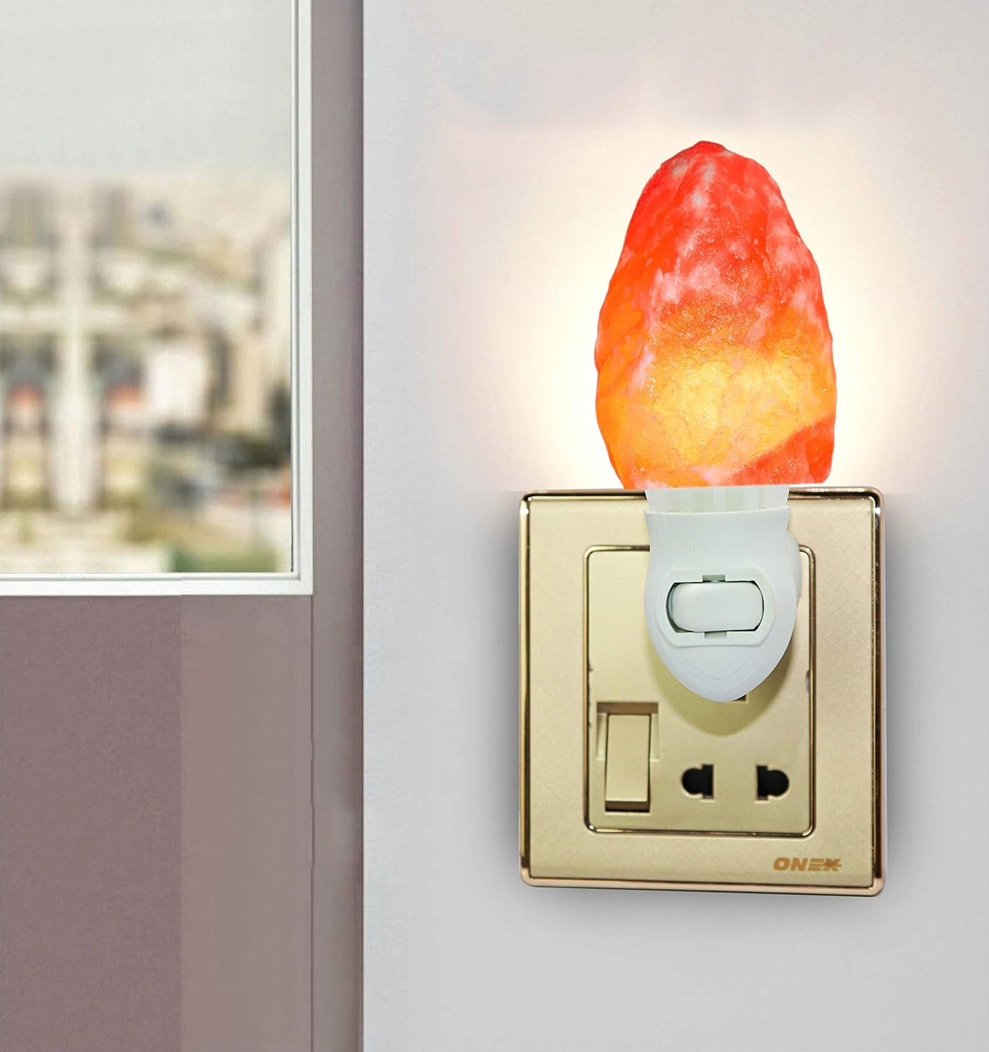 Decorative night light shaped like a campfire attached to a wall switch.
