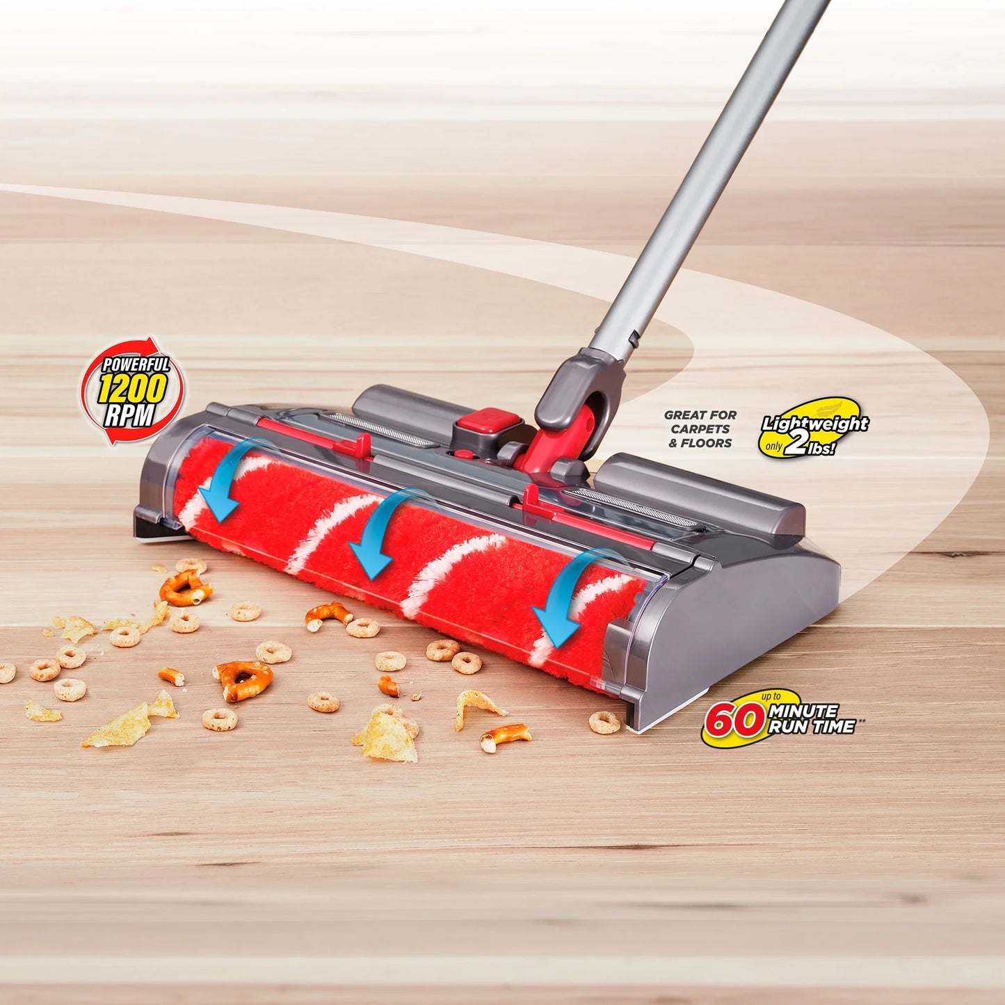 Vacuum cleaner head cleaning up cereal spills on a wooden floor with feature labels.