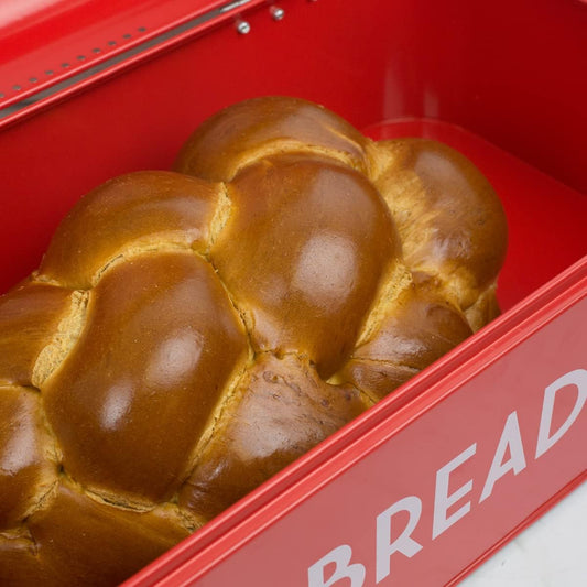 Loaf of bread in a red bread box with 'BREAD' text