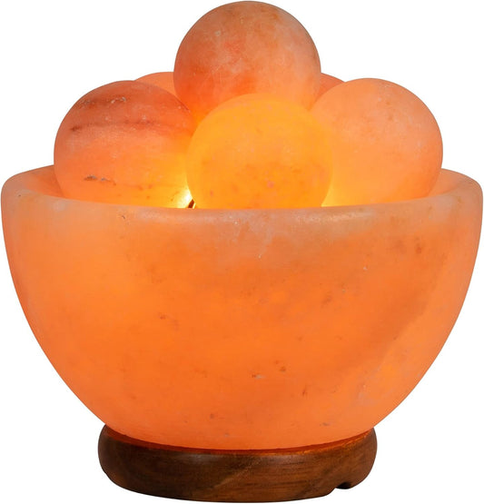 Himalayan salt lamp with spherical salt crystals on a white background