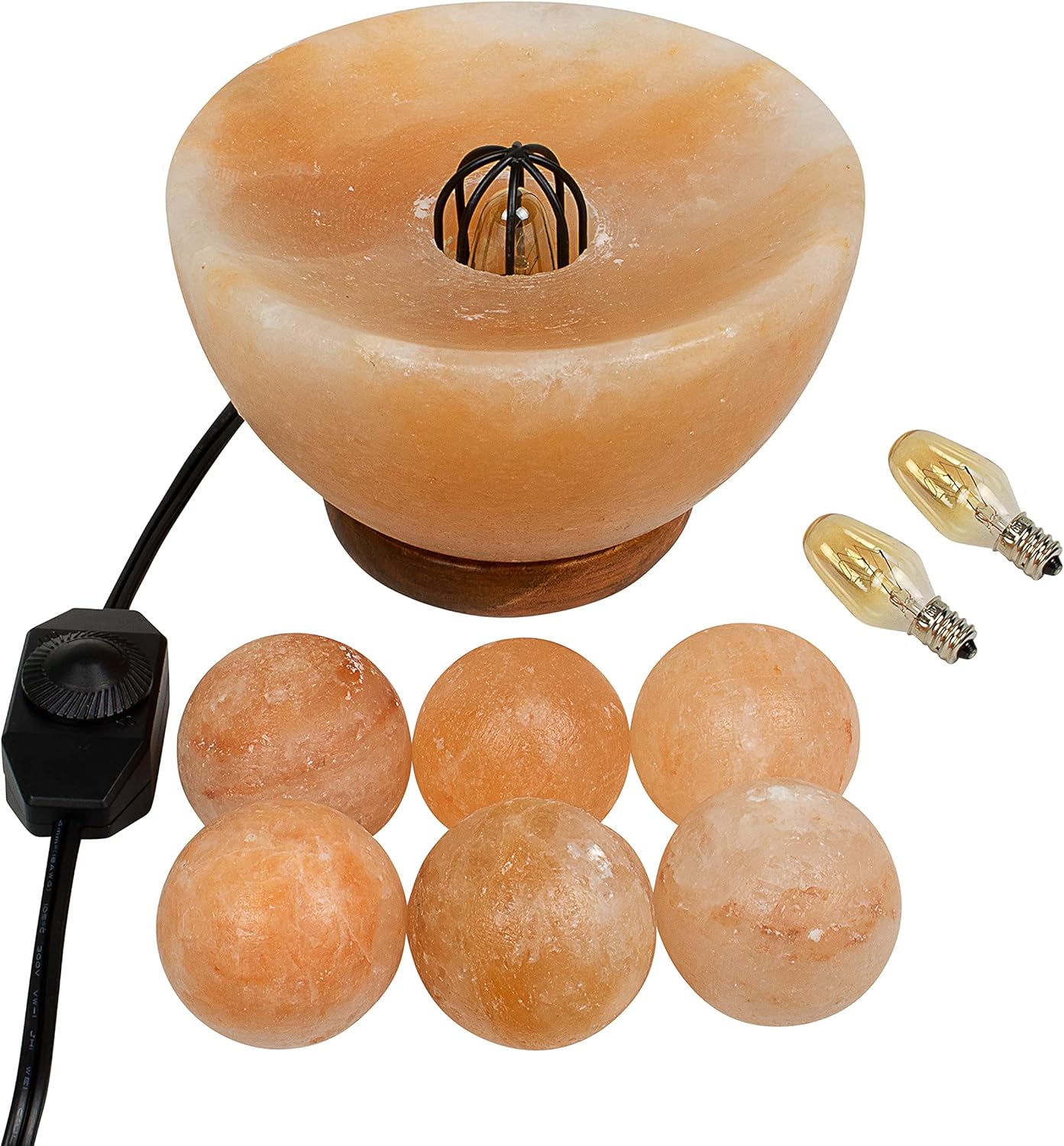 Himalayan salt lamp with bulb and salt crystals on a white background