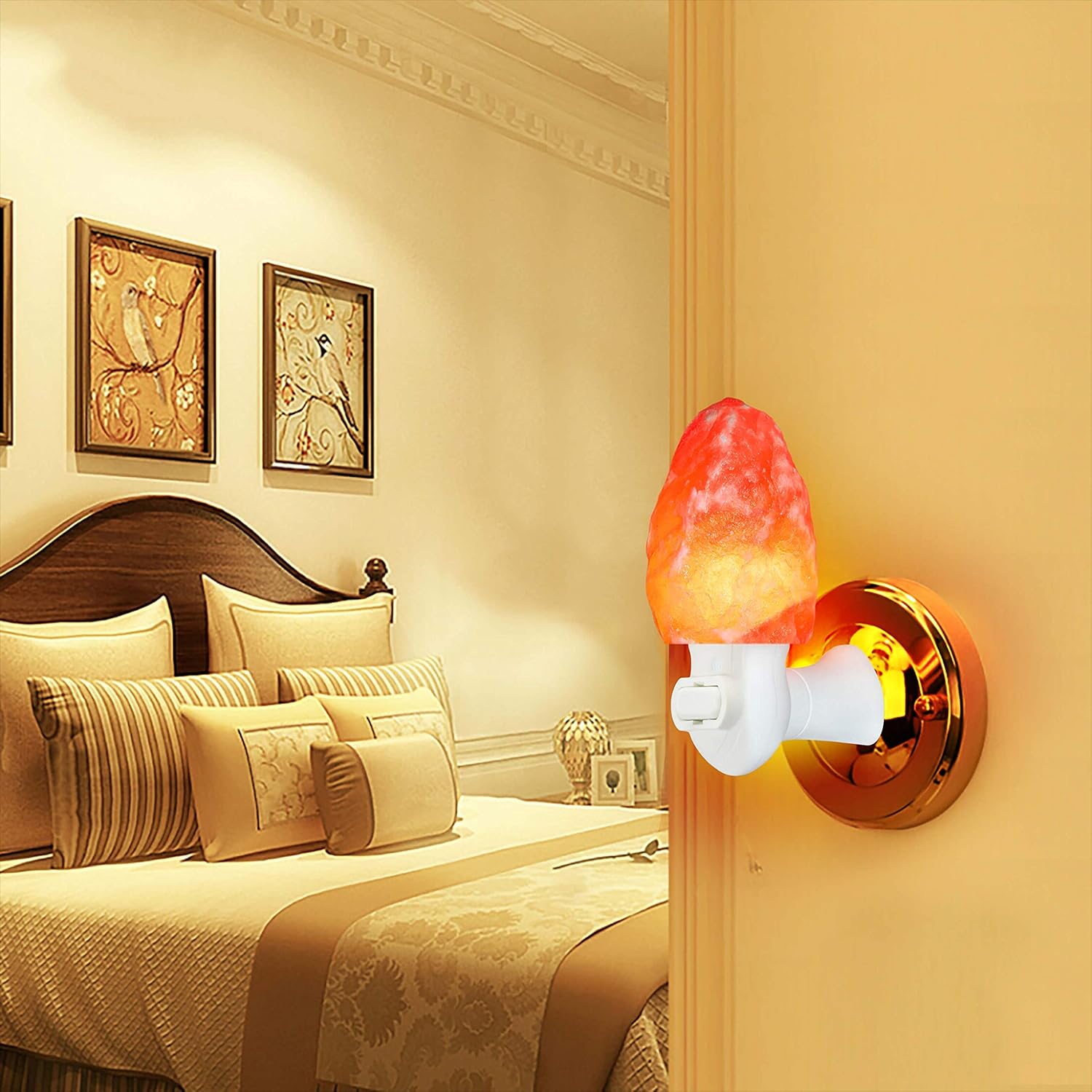 Decorative wall lamp in a bedroom setting with a bed and framed artwork.