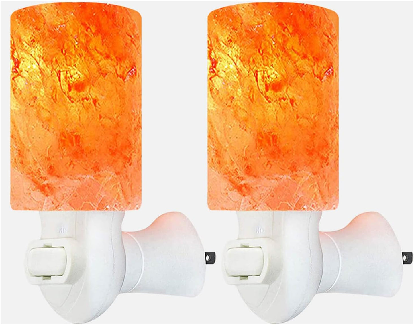 Two orange cylindrical night lights on white background