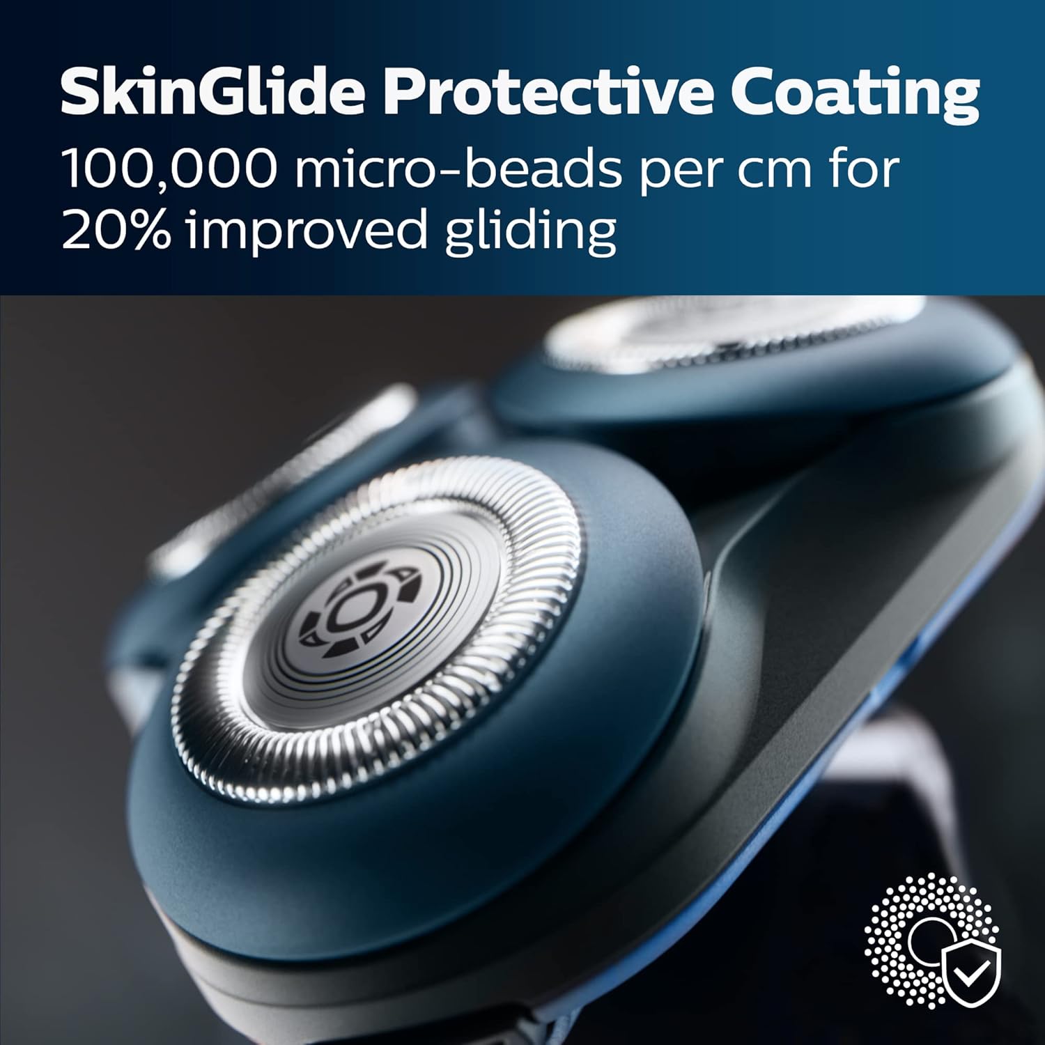 Shaver head with SkinGlide Protective Coating feature on a dark background