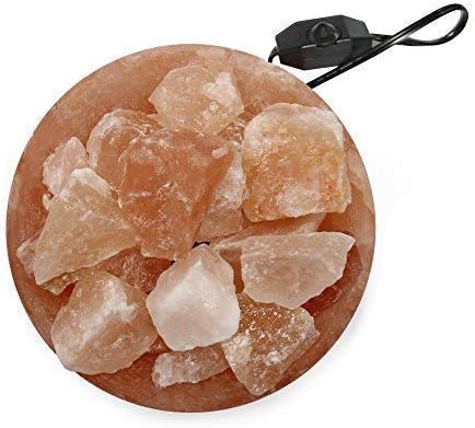 Himalayan salt lamp with natural rock salt on a white background