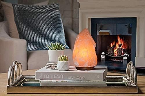 Salt lamp on a coffee table with a fireplace in the background