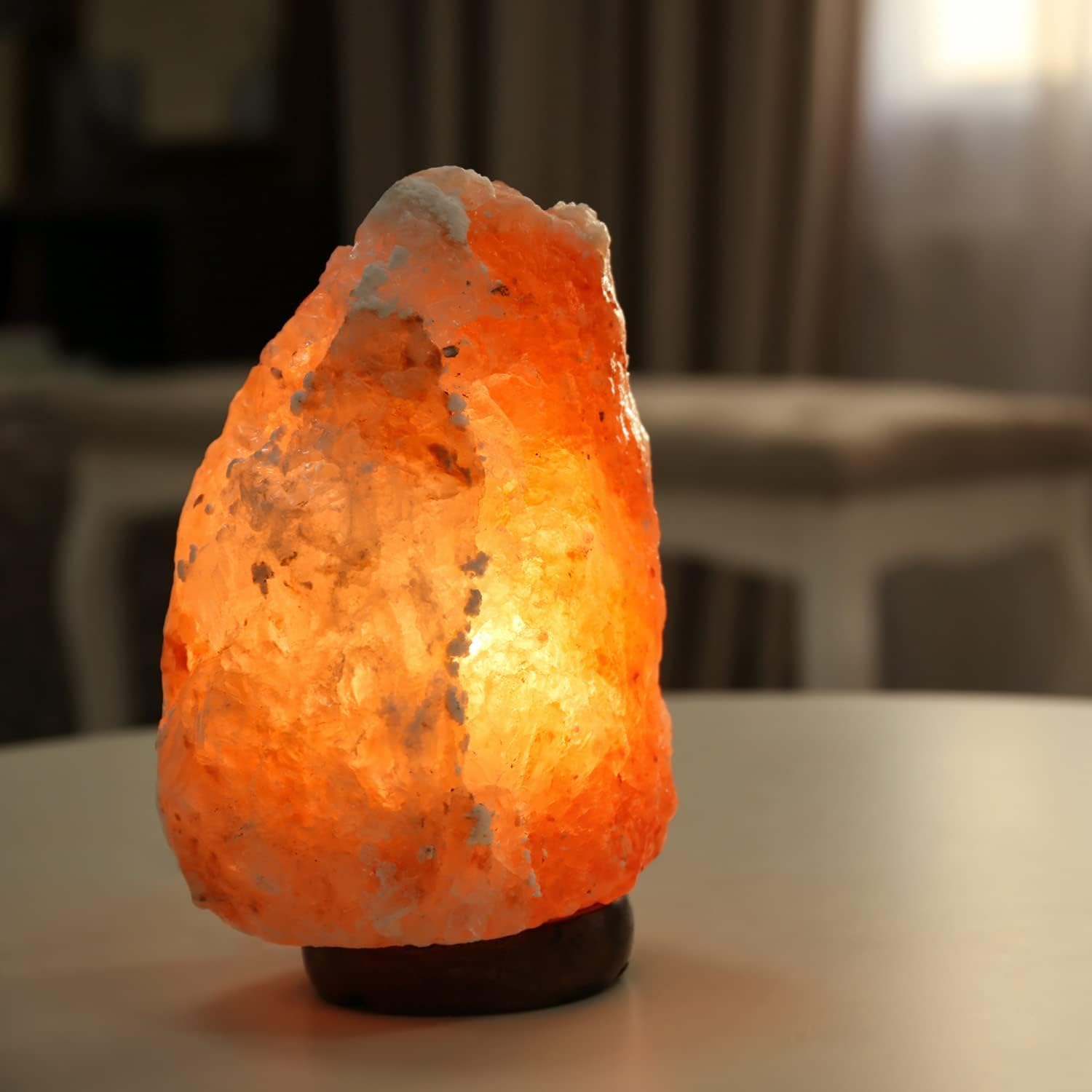 Himalayan salt lamp on a table with a blurred background