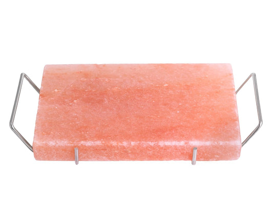 Himalayan salt block with metal holder on a white background