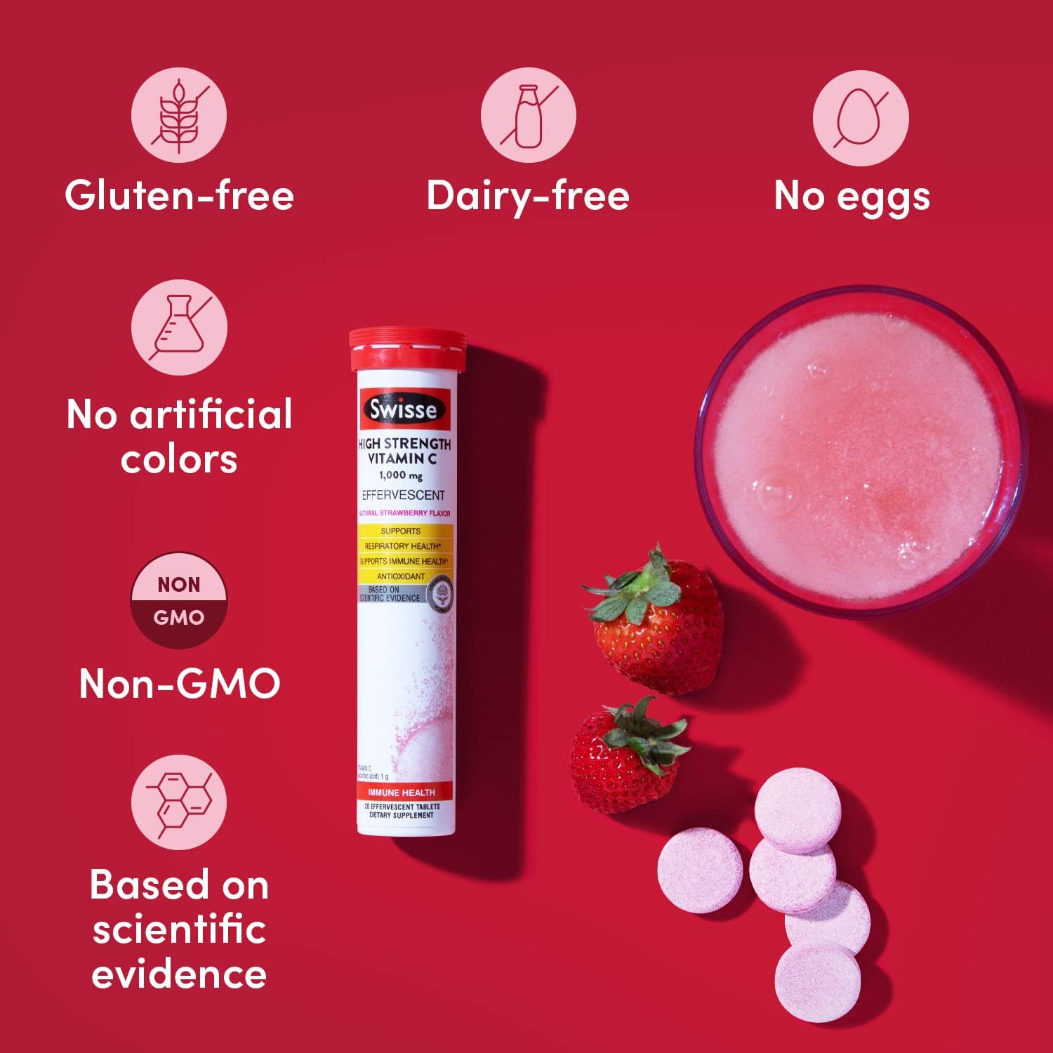 Swiss Vitamin C supplement with strawberry, tablets, and drink on a red background