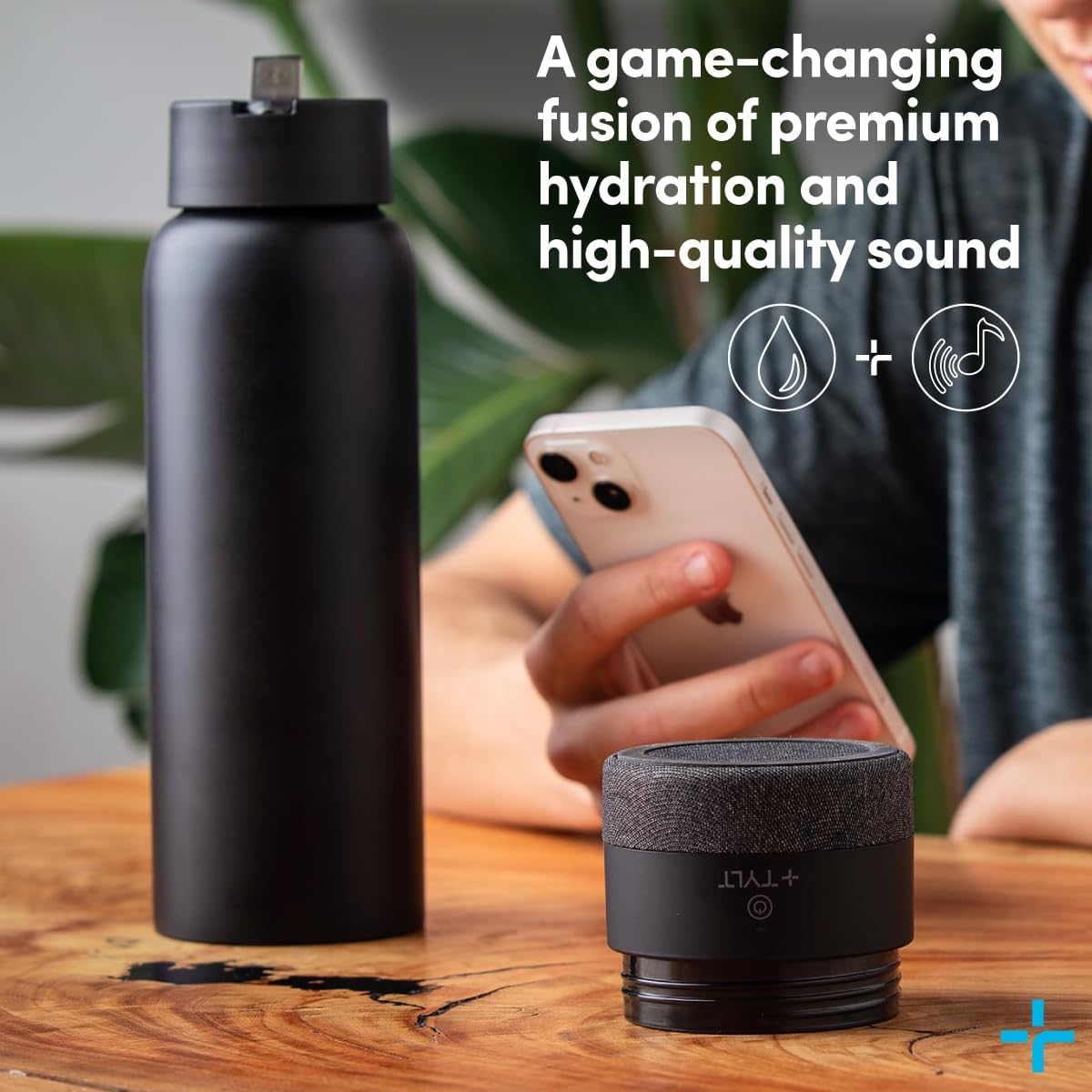Black water bottle and speaker on a table with text about hydration and sound.