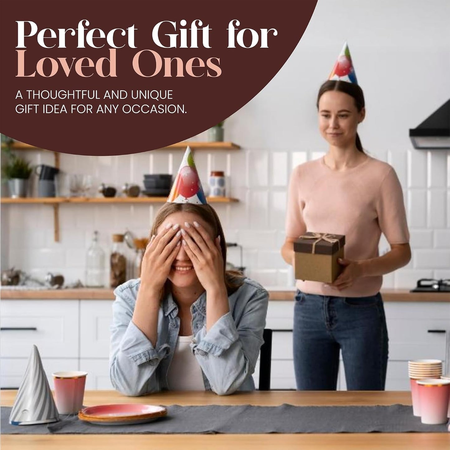Two people in a kitchen with one holding a gift box and the other covering their face, with text about a perfect gift for loved ones.
